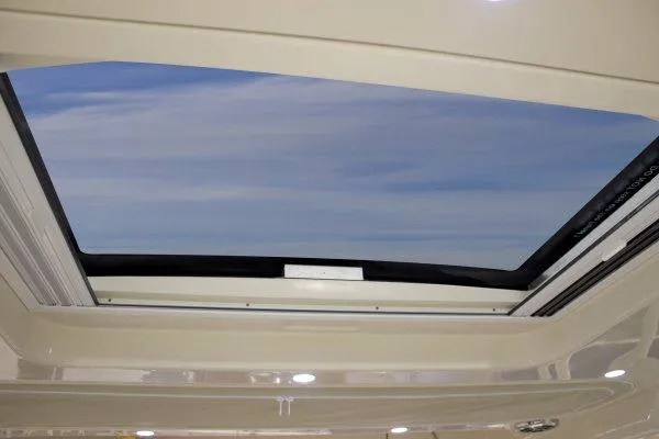  Yacht Photos Pics Manufacturer Provided Image: Sunroof view from 2015 Grady-White Freedom 375 boat, showcasing clear blue sky.