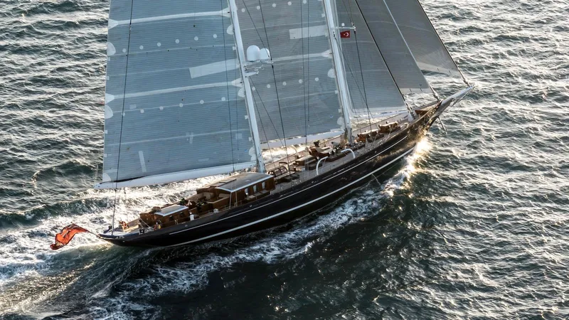 Meteor Yacht Photos Pics Royal Huisman 2007 schooner sailing on open sea, elegant design and craftsmanship.