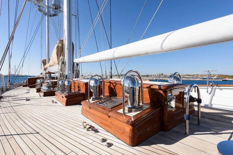 Meteor Yacht Photos Pics Luxurious 2007 Royal Huisman Schooner deck with polished wood and chrome details.