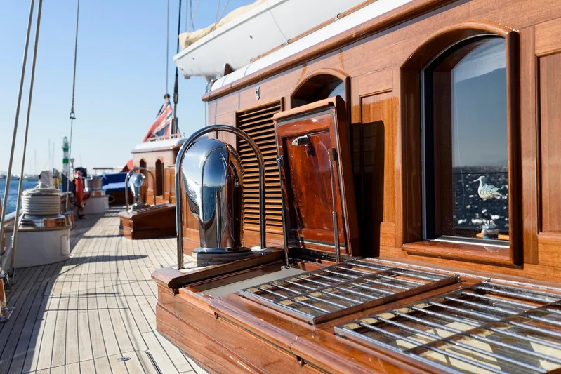 Meteor Yacht Photos Pics Royal Huisman Schooner 2007 deck with polished wood and chrome details.