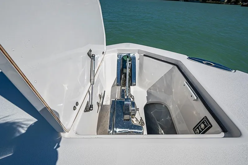  Yacht Photos Pics Open anchor compartment on 2018 Sea Fox 328 Commander boat, showing winch and hardware.