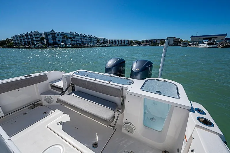  Yacht Photos Pics 2018 Sea Fox 328 Commander boat with dual engines, docked near waterfront buildings.