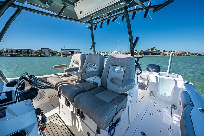  Yacht Photos Pics 2018 Sea Fox 328 Commander boat interior with plush seating and steering console.
