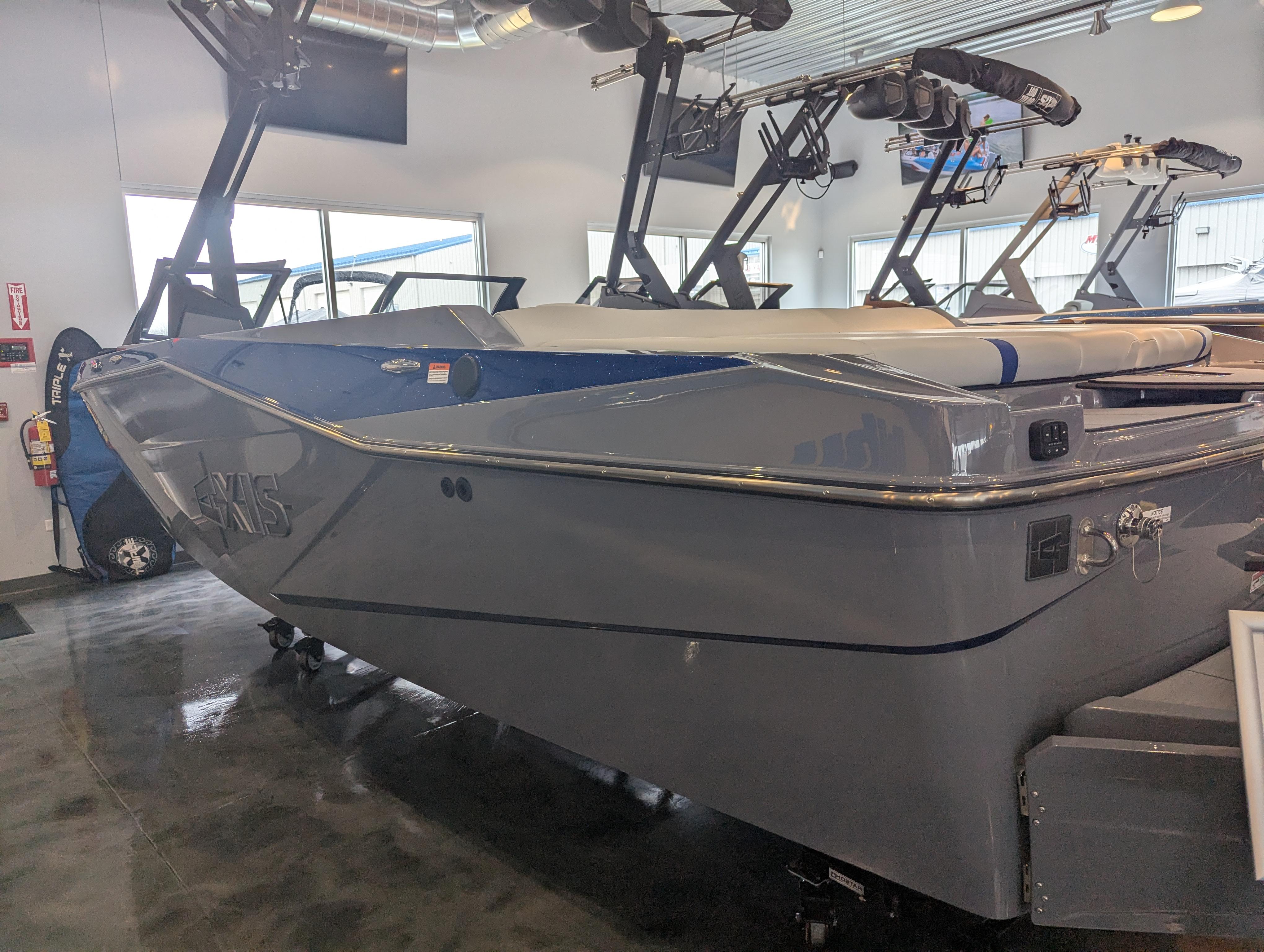 2025 Axis T220 boat in showroom, sleek gray design with modern features.
