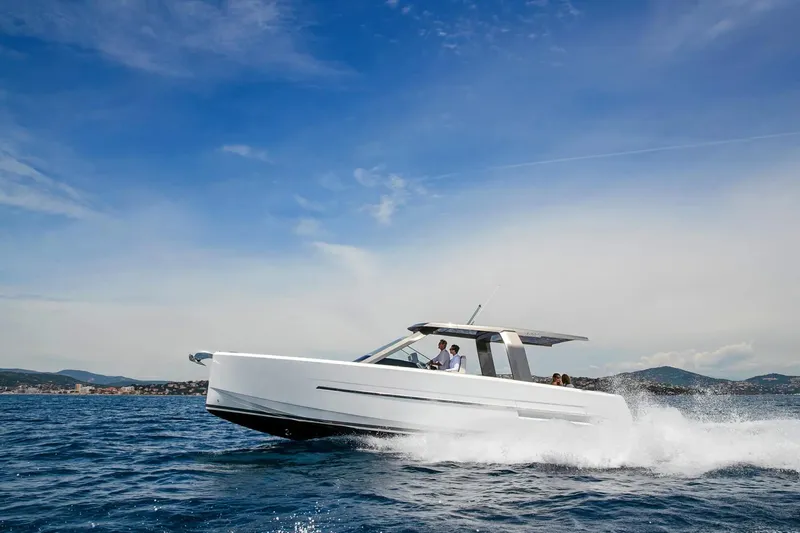  Yacht Photos Pics 2025 Hanse Fjord 39 XL yacht cruising on open water under a clear blue sky.
