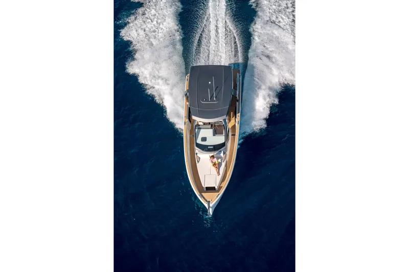  Yacht Photos Pics 2025 Hanse Fjord 39 XL yacht cruising on open blue water, aerial view.