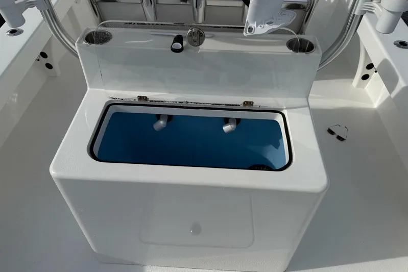  Yacht Photos Pics 2023 T Craft 27 boat livewell with open lid, showcasing interior design.