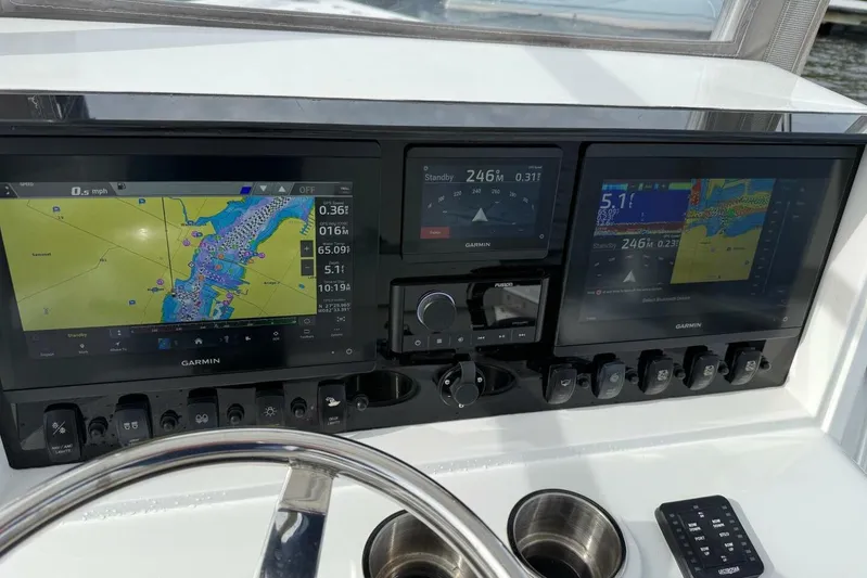  Yacht Photos Pics Dashboard of 2023 T Craft 27 boat with Garmin navigation displays.