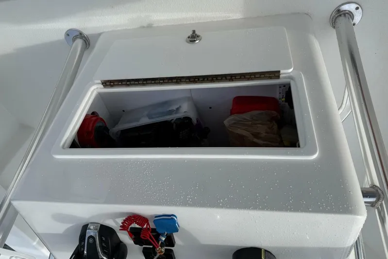  Yacht Photos Pics Storage compartment on a 2023 T Craft 27 boat, featuring a sleek white design.
