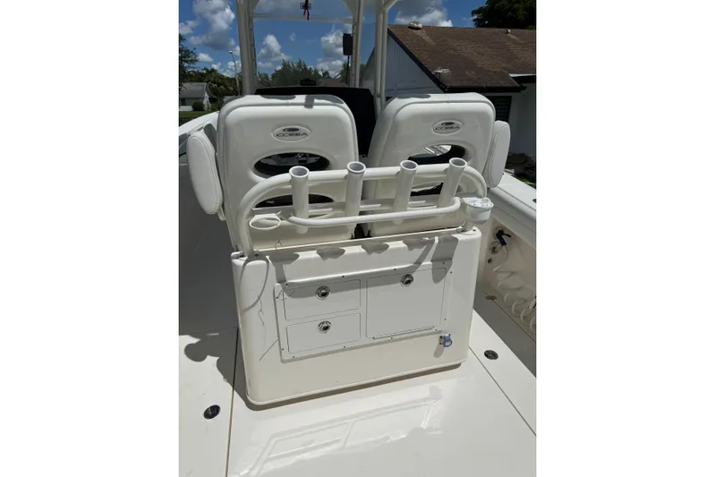  Yacht Photos Pics 2024 Cobia 280 Center Console boat interior with rod holders and storage compartments.