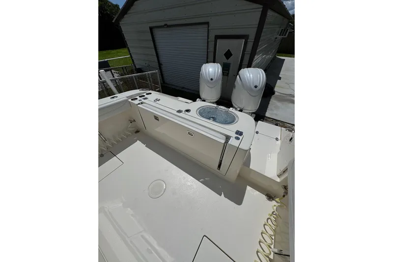  Yacht Photos Pics 2024 Cobia 280 Center Console boat with dual engines and spacious deck.