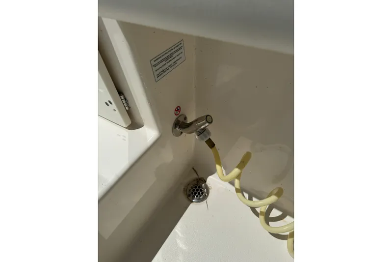  Yacht Photos Pics 2024 Cobia 280 Center Console boat washdown hose and drain detail.