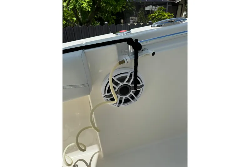  Yacht Photos Pics 2024 Cobia 280 Center Console boat interior with speaker and coiled hose.