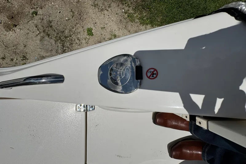  Yacht Photos Pics 2024 Cobia 280 Center Console boat deck with fuel cap and no smoking sign.