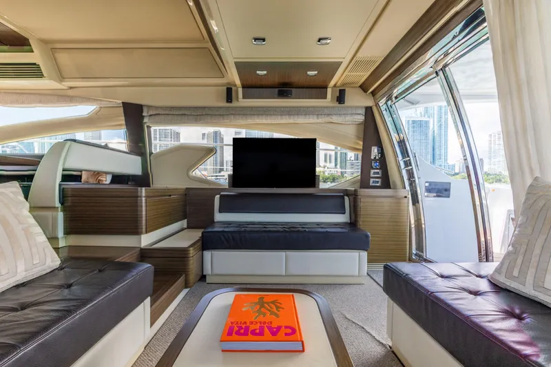 Prime Time II Yacht Photos Pics Luxurious interior of 2016 Azimut 64 Flybridge yacht with modern furnishings and city view.