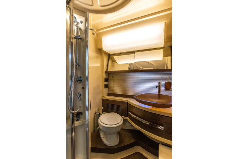 Prime Time II Yacht Photos Pics Luxurious bathroom in 2016 Azimut 64 Flybridge yacht with modern fixtures and elegant design.