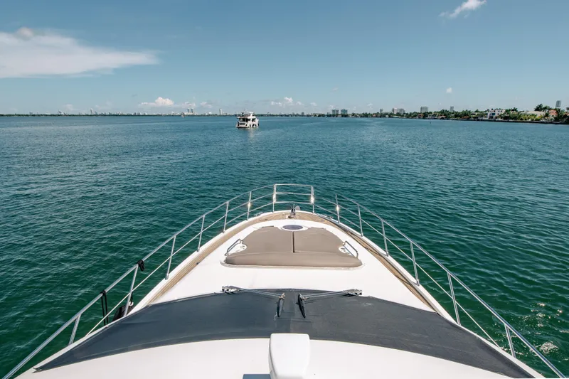 Prime Time II Yacht Photos Pics Bow view of 2016 Azimut 64 Flybridge yacht cruising on open water.