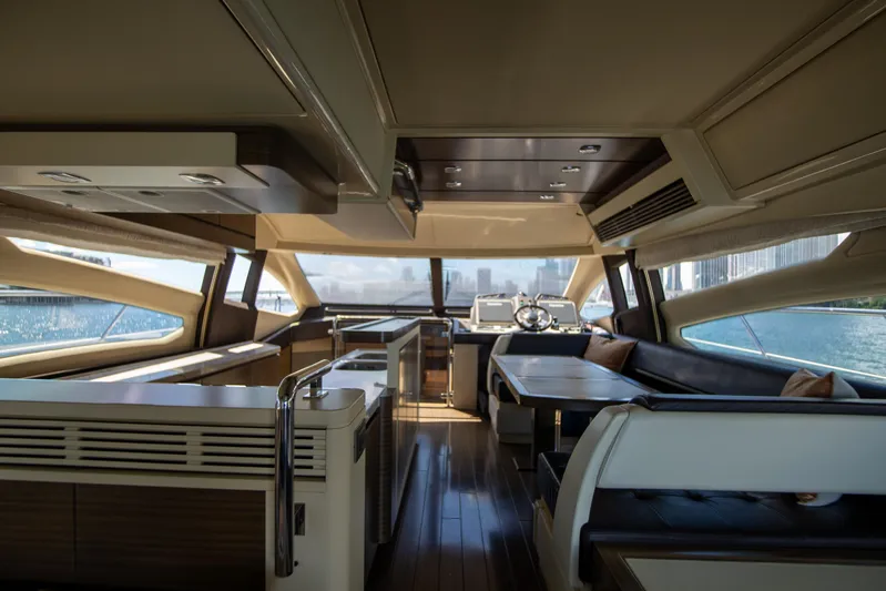 Prime Time II Yacht Photos Pics Luxurious interior of 2016 Azimut 64 Flybridge yacht with modern design and city skyline view.