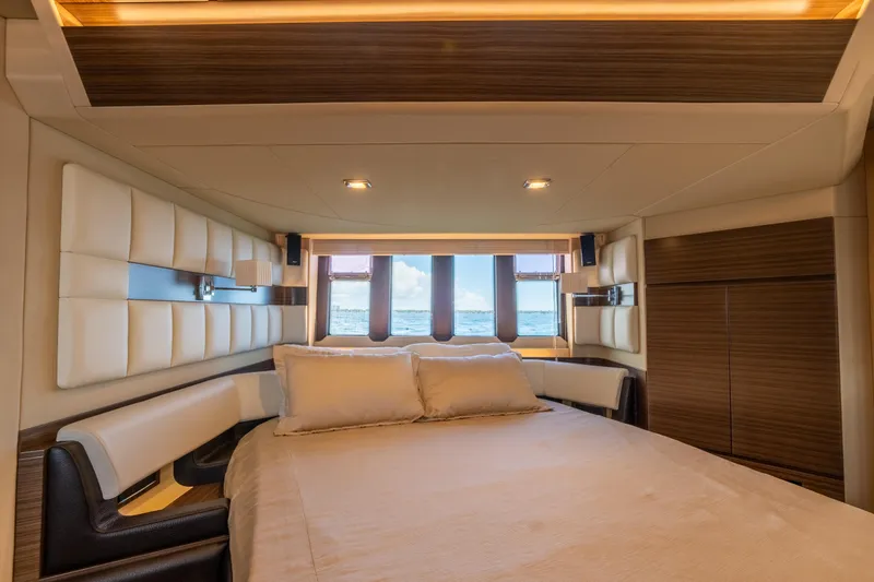 Prime Time II Yacht Photos Pics Luxurious bedroom interior of 2016 Azimut 64 Flybridge yacht with ocean view.