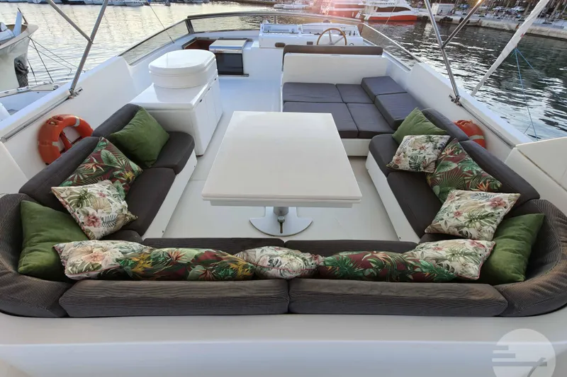  Yacht Photos Pics Luxurious 1999 Sanlorenzo SL82 yacht deck with elegant seating and tropical cushions.