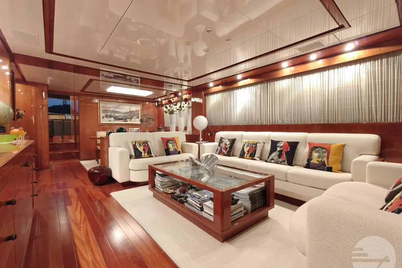 Yacht Photos Pics Luxurious interior of 1999 Sanlorenzo SL82 yacht with elegant wood finishes and modern decor.
