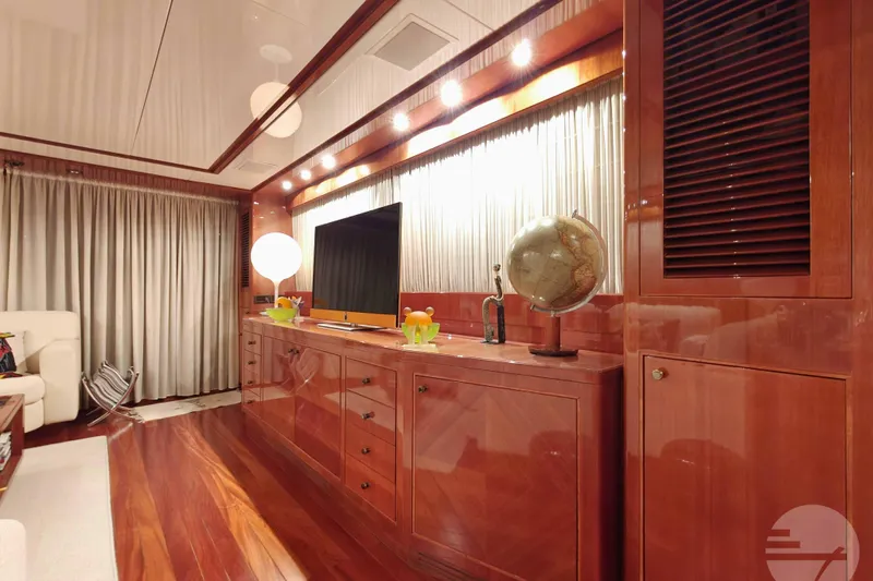  Yacht Photos Pics Luxurious interior of 1999 Sanlorenzo SL82 yacht with elegant wood finishes and modern decor.