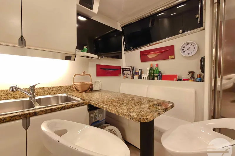  Yacht Photos Pics Luxurious 1999 Sanlorenzo SL82 yacht interior with granite countertop and modern amenities.