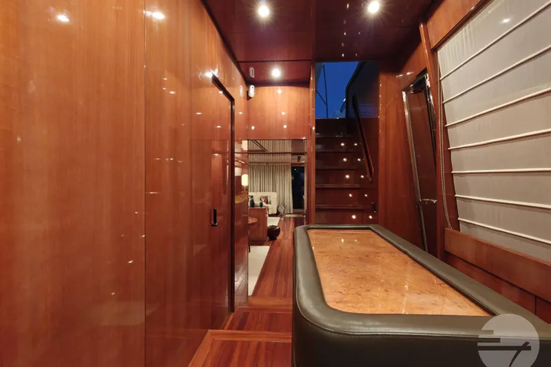  Yacht Photos Pics Luxurious interior of 1999 Sanlorenzo SL82 yacht with polished wood finishes and elegant lighting.