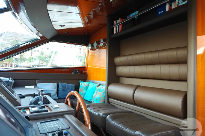  Yacht Photos Pics Luxurious interior of 1999 Sanlorenzo SL82 yacht with leather seating and wooden accents.