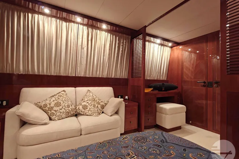  Yacht Photos Pics Luxurious cabin interior of 1999 Sanlorenzo SL82 yacht with elegant wood finishes.