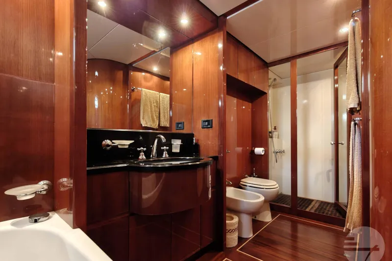  Yacht Photos Pics Luxurious bathroom on 1999 Sanlorenzo SL82 yacht with wood paneling and modern fixtures.