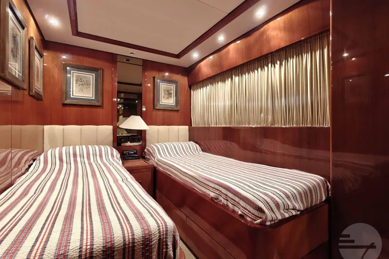  Yacht Photos Pics Luxurious twin bedroom on 1999 Sanlorenzo SL82 yacht with elegant wood paneling.