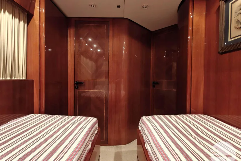  Yacht Photos Pics Luxurious Sanlorenzo SL82 yacht cabin interior with twin beds, wood paneling, and elegant decor.