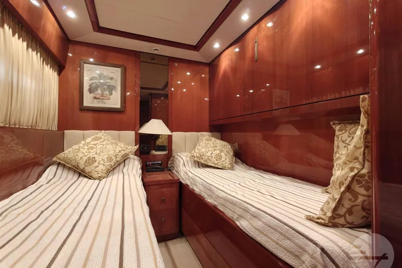 Yacht Photos Pics Luxurious twin cabin interior of 1999 Sanlorenzo SL82 yacht with elegant wood finish.