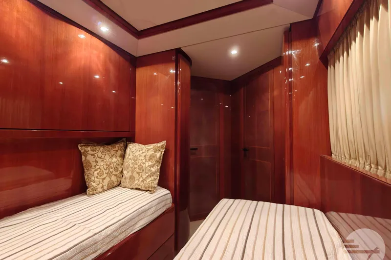  Yacht Photos Pics Luxurious cabin interior of 1999 Sanlorenzo SL82 yacht with twin beds and elegant wood finish.