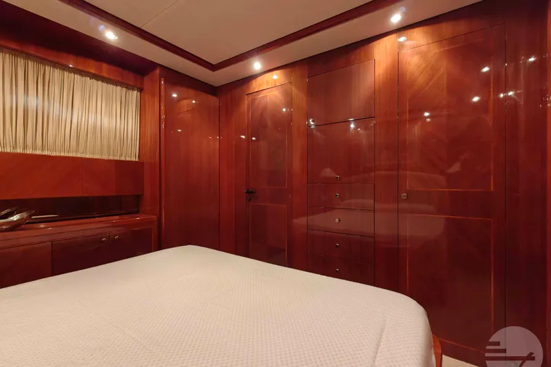  Yacht Photos Pics Luxurious wooden interior of 1999 Sanlorenzo SL82 yacht cabin with elegant lighting.