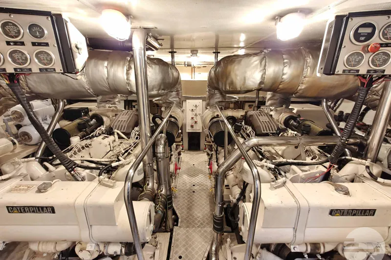  Yacht Photos Pics Engine room of 1999 Sanlorenzo SL82 yacht with Caterpillar engines and control panels.