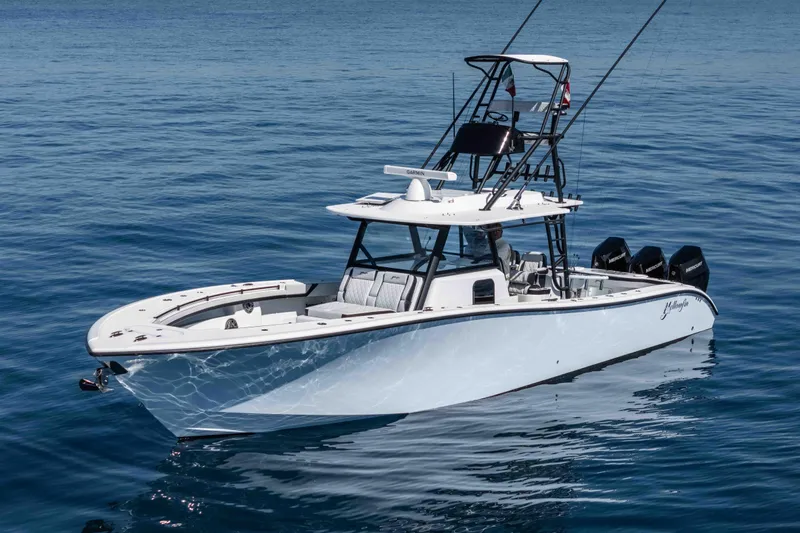  Yacht Photos Pics 2025 Yellowfin 42 Offshore boat on calm blue water.