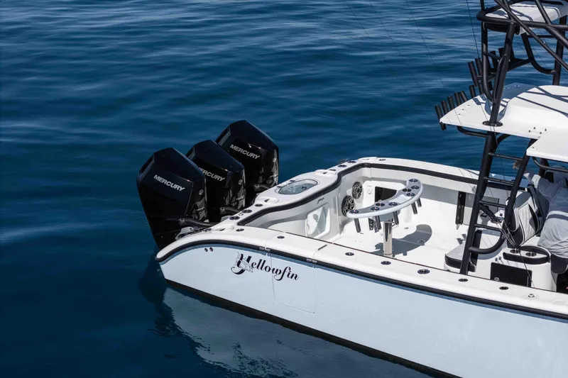  Yacht Photos Pics 2025 Yellowfin 42 Offshore boat with triple Mercury engines on calm water.