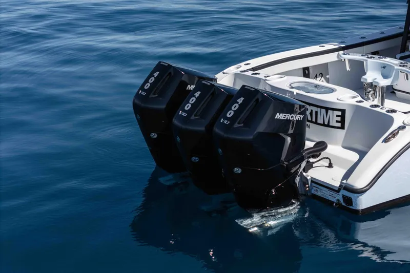  Yacht Photos Pics 2025 Yellowfin 42 Offshore boat with triple Mercury 400 V10 engines on calm water.