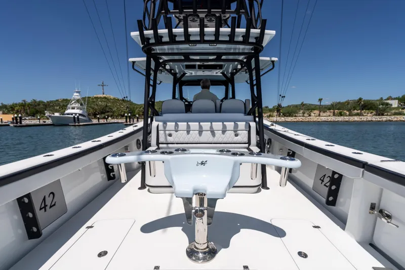  Yacht Photos Pics 2025 Yellowfin 42 Offshore boat, spacious deck, sleek design, docked in sunny marina.