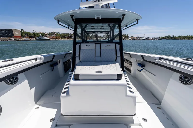  Yacht Photos Pics 2025 Yellowfin 42 Offshore boat interior with luxurious seating and modern design on the water.