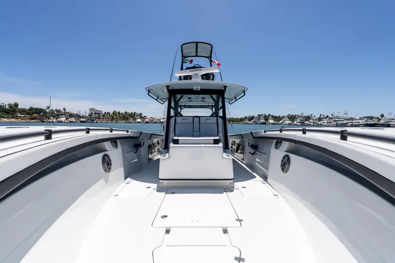  Yacht Photos Pics 2025 Yellowfin 42 Offshore boat, spacious deck, sleek design, docked in a marina.