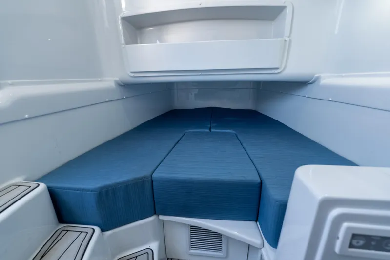  Yacht Photos Pics Interior cabin of 2025 Yellowfin 42 Offshore boat with blue cushions.