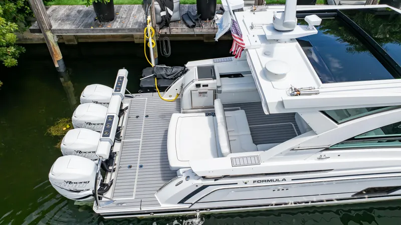  Yacht Photos Pics 2021 Formula 430 Super Sport Crossover yacht docked with triple outboard engines.