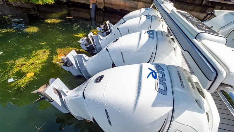  Yacht Photos Pics 2021 Formula 430 Super Sport Crossover with multiple outboard engines docked in water.