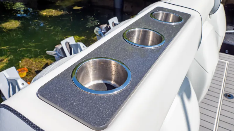  Yacht Photos Pics Cup holders on 2021 Formula 430 Super Sport Crossover boat, near water.