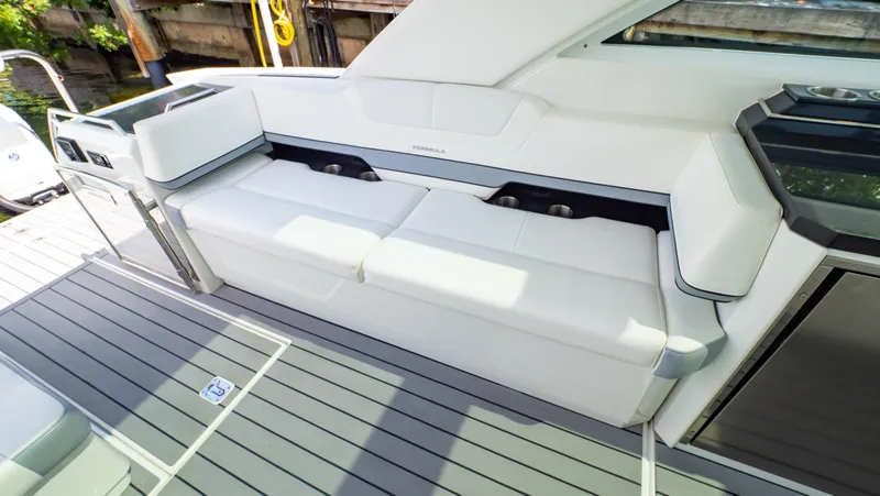  Yacht Photos Pics 2021 Formula 430 Super Sport Crossover boat interior with sleek white seating.