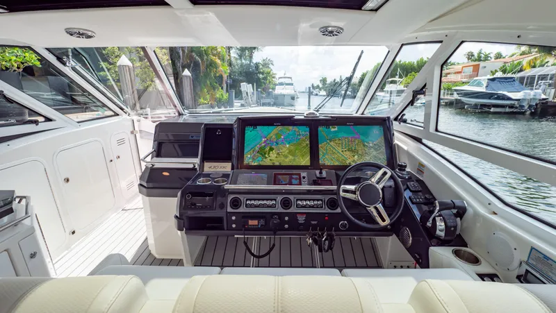  Yacht Photos Pics 2021 Formula 430 Super Sport Crossover helm with dual navigation screens and luxurious interior.