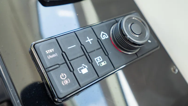 Yacht Photos Pics Control panel of 2021 Formula 430 Super Sport Crossover with various buttons and a dial.